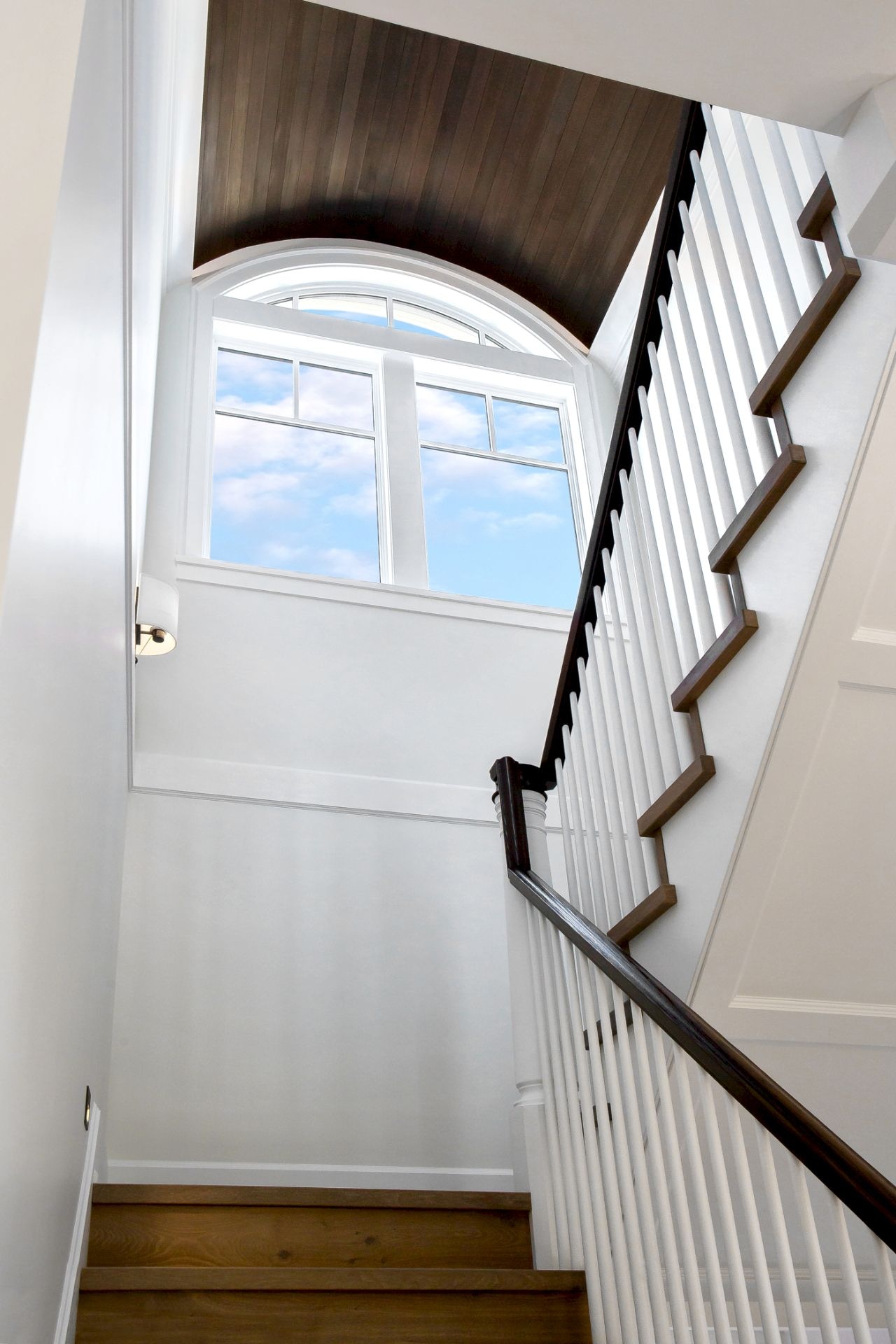 staircase with curved ceiling in King George Terrace home