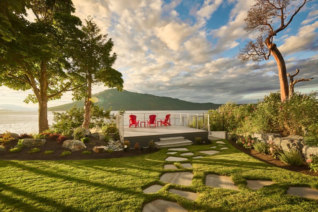 patio on waterfront edge overlooking sunset